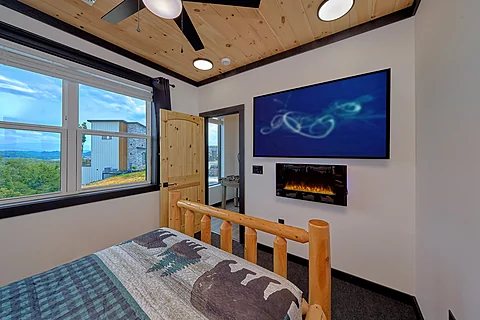 Queen Bedroom with Electric Fireplace & TV - A Soaky Adventure