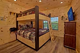 Family cabin with queen bunk bedroom