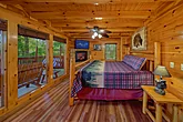 Cabin Master bedroom with king bed and fireplace