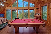 Cabin game room with pool table and views