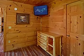 Cozy Cabin bedroom with King Bed and TV