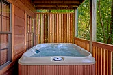 4 bedroom cabin with hot tub and wooded views