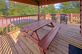 1 bedroom cabin with a picnic table on deck 