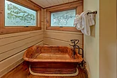 Soaking tub in 4 bedroom cabin bathroom