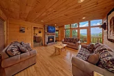 Living room fireplace in 4 bedroom cabin rental