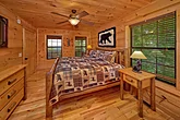 Main level master Bedroom in 4 bedroom cabin