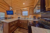 Fully furnished kitchen in tiny home cabin