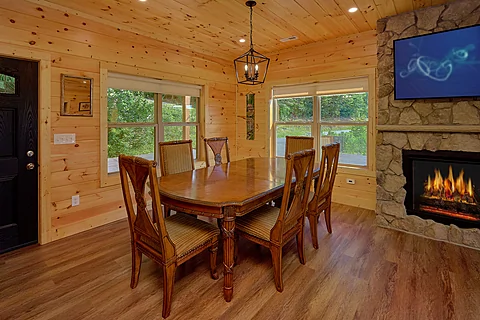 Dining room with fireplace in 3 bedroom cabin  - Mountain Harmony