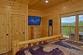 Cabin bedroom with TV and private bathroom