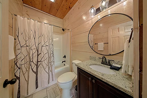 Bathroom with a tub/shower combo - Rocky Top Lodge